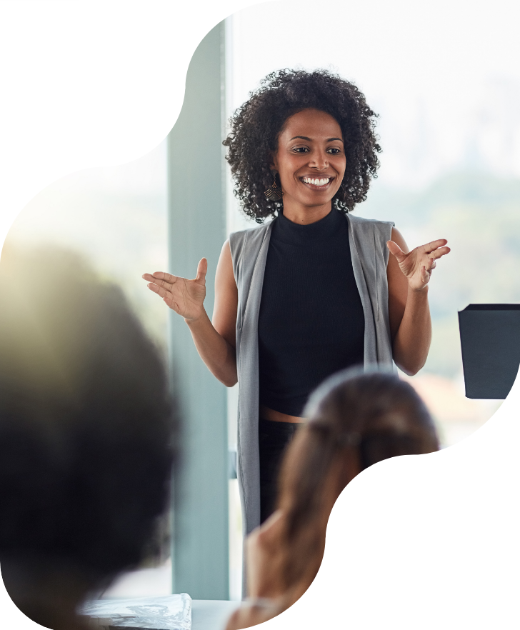 Smiling-Presenter_in-front-of-class